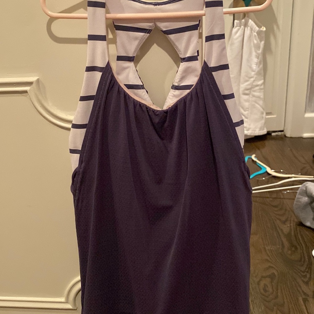 purple and white ivivva tank top